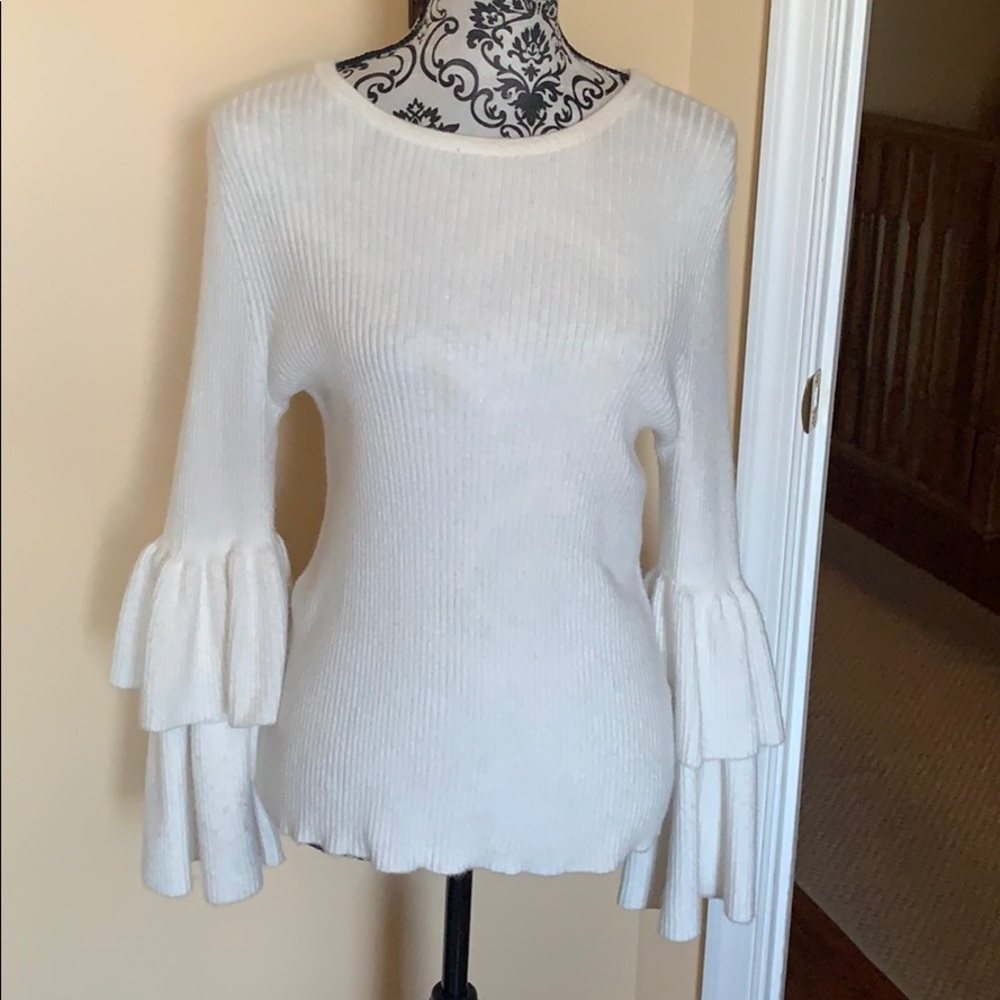 Eva Mendes wool sweater with ruffled sleeves